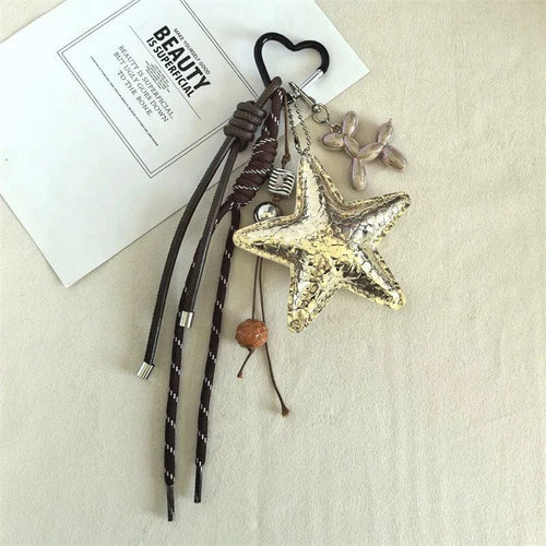 Attache Bijoux de Sac Étoile en Cuir Gold