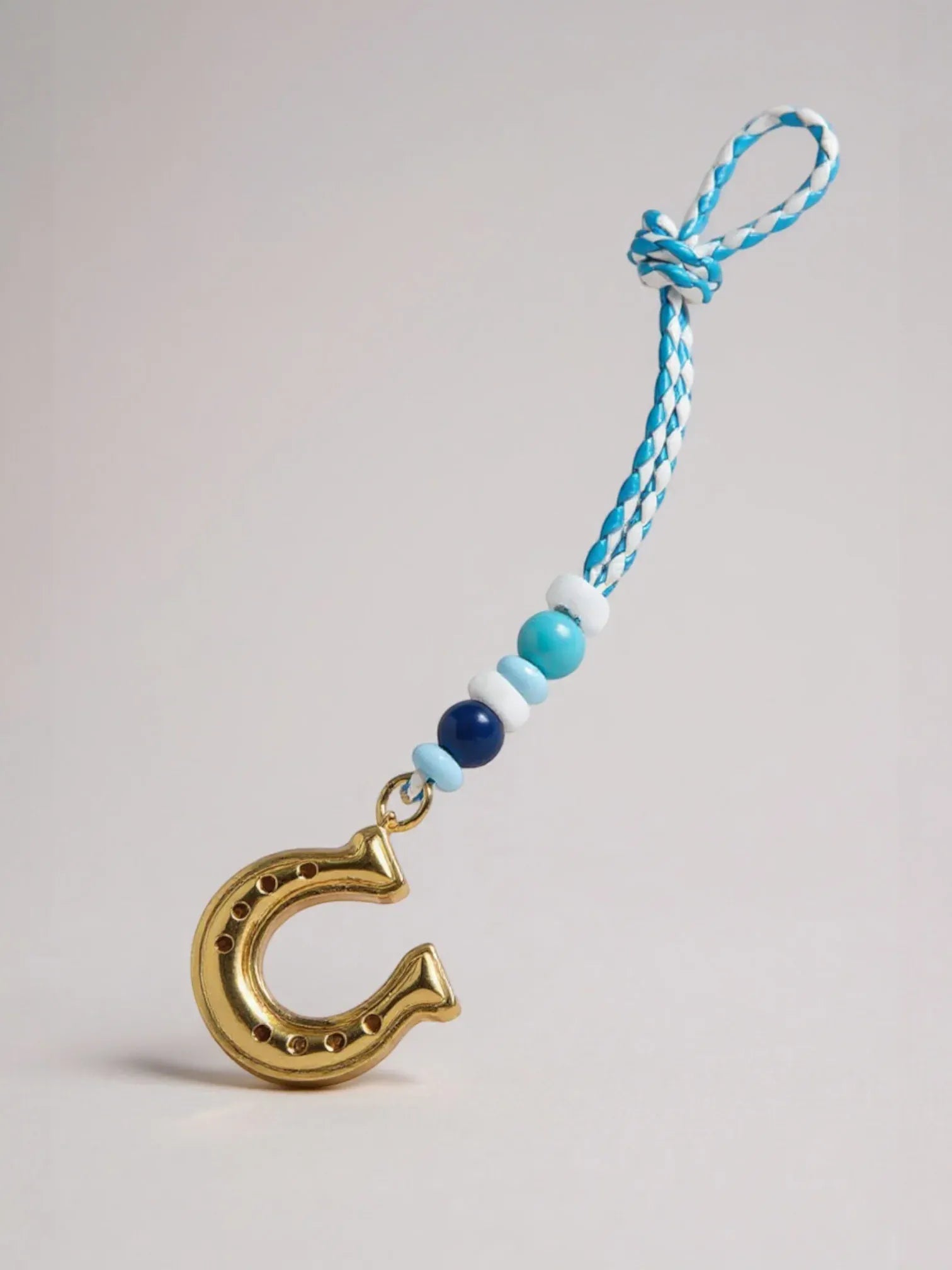 Bijou de Sac Fer a Cheval Bleu et Or